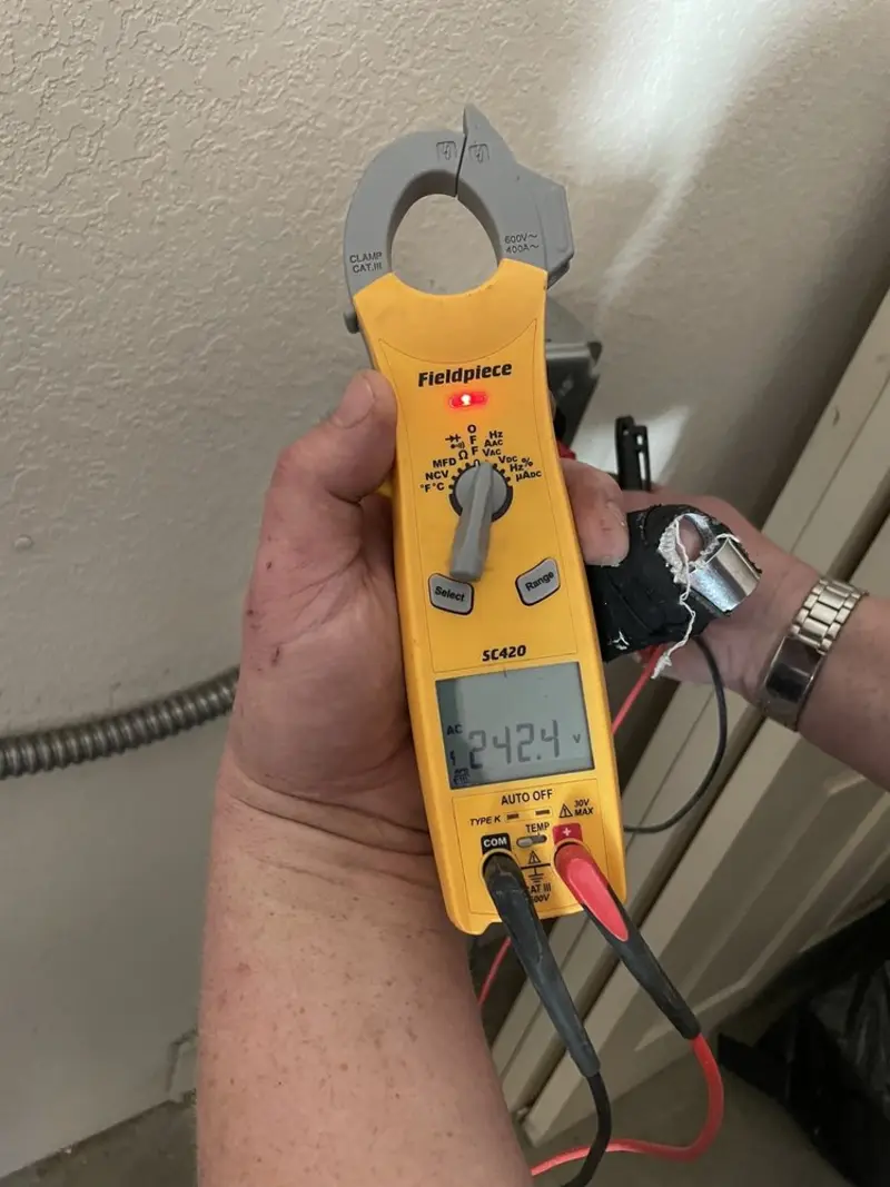 Voltage testing with clamp meter during Circuit Breaker Repair in Glasgow